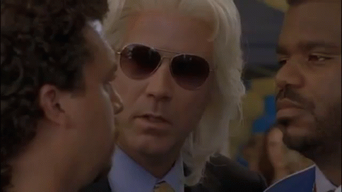 Man in Sunglasses Talking to Another Man