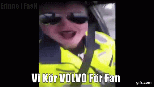 Man in Sunglasses Yellow Jacket Driving Says Vi Kör Volvo for Fan