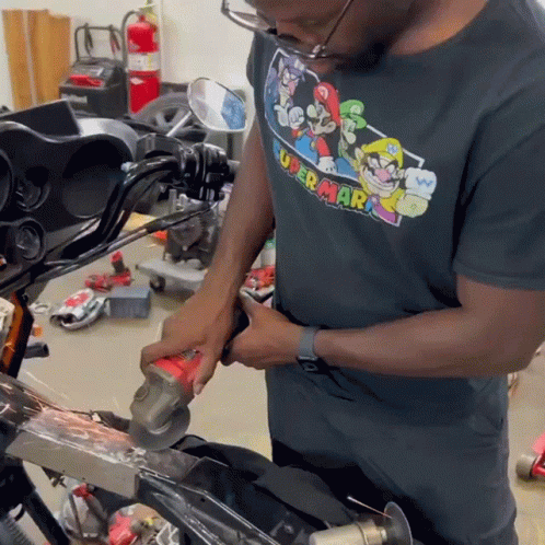 Man in Super Mario T-Shirt Grinding Metal