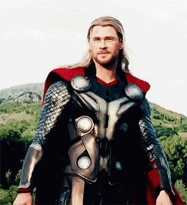 Man in Superhero Costume in Front of Mountain