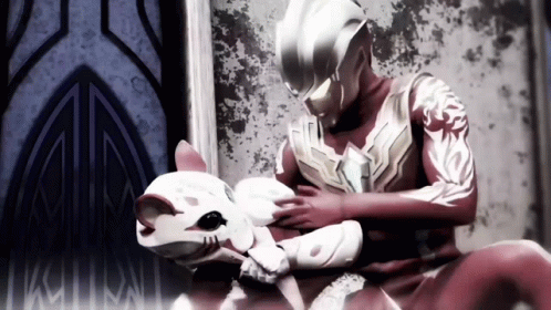 Man in Superhero Costume Petting Cat