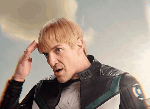 Man In Superhero Costume With Letter L GIF
