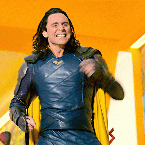 Man in Superhero Costume with Yellow Cape Smiling