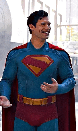 Man in Superman Costume and Cape Smiling