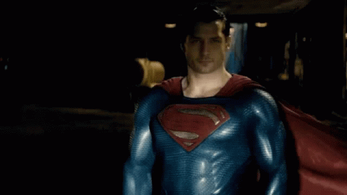 Man in Superman Costume and Red Cape