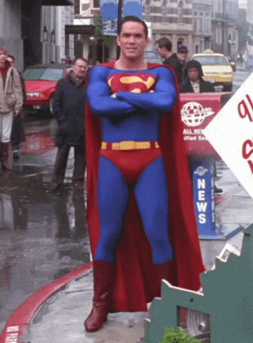 Man in Superman Costume at News Box