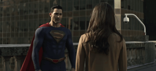 Man in Superman Costume Hugging Woman