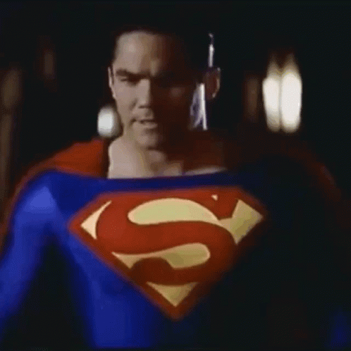 Man In Superman Costume In Dark