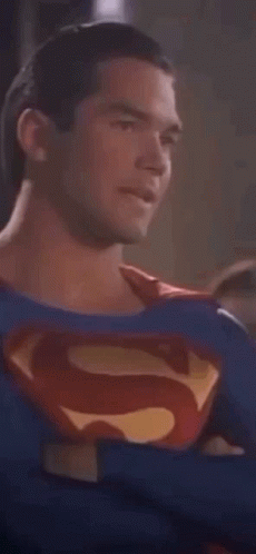 Man in Superman Costume Looking at Camera
