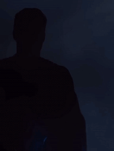 Man in Superman Costume Looking at Camera