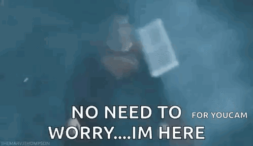 Man in Superman Costume Saying No Need to Worry I'm Here