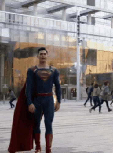 Man in Superman Costume Walking Street