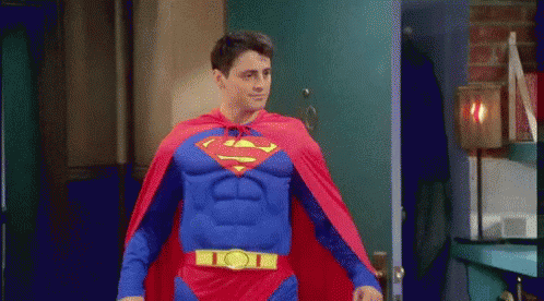 Man in Superman Costume Walking Through Doorway
