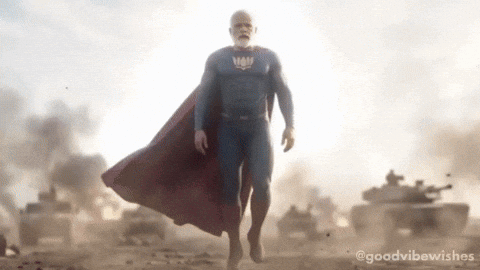 Man In Superman Costume Walking GIF