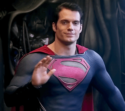Man in Superman Costume Waving