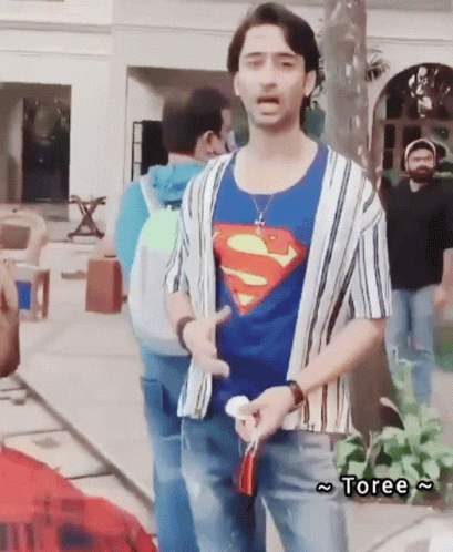 Man in Superman T-Shirt Standing Before Group