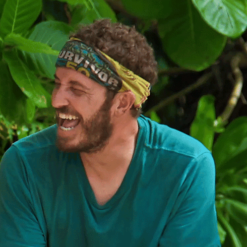 Man in Survivor Headband Laughing