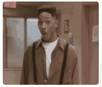 Man in Suspenders Mouth Open in Hallway