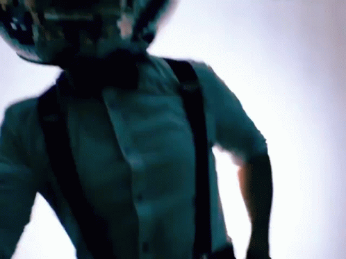 Man in Suspenders With Disco Ball on Head