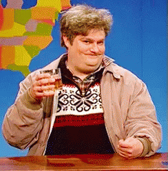 Man In Sweater And Jacket Holding Whiskey GIF