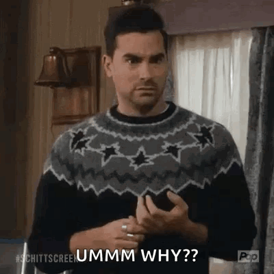 Man In Sweater Asking Why On Phone GIF