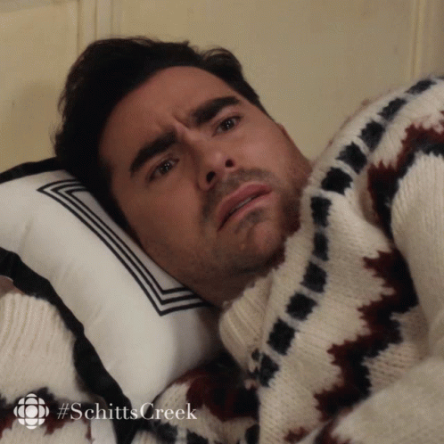 Man In Sweater Lying On Pillow Schitts Creek GIF