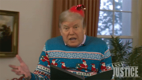 Man in Sweater Saying Merry