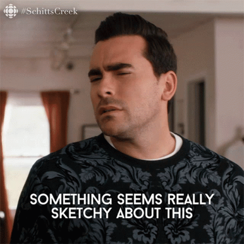 Man in Sweater Saying Something Sketchy