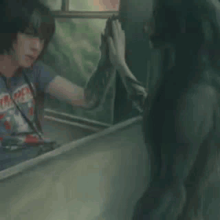 Man In T-Shirt Looking In Mirror GIF