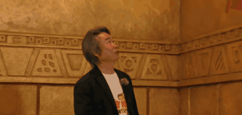 Man in T-Shirt Looking Up