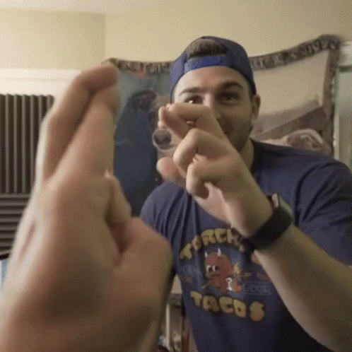 Man In Tacos Shirt Making Heart GIF