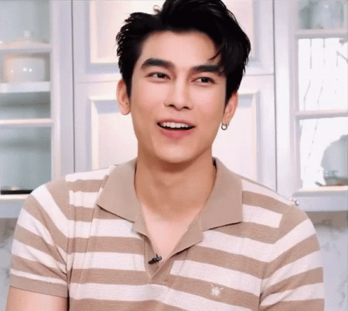 Man in Tan and White Striped Shirt with Bee