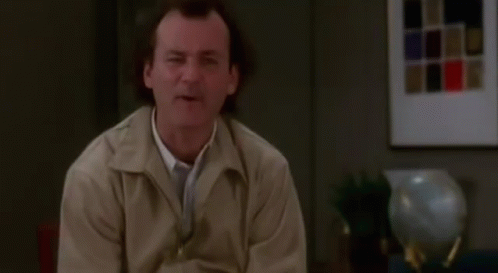 Man In Tan Jacket Making Funny Face GIF
