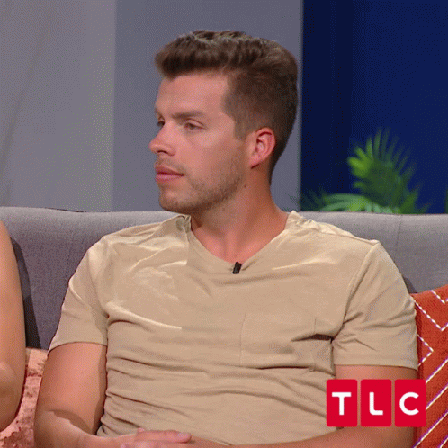 Man In Tan Shirt On Couch With TLC GIF