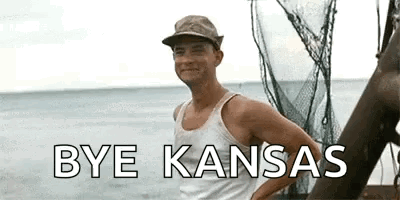 Man in Tank Top and Hat Saying Bye Kansas