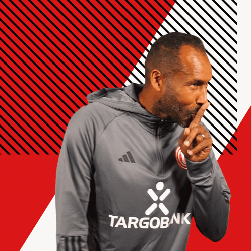 Man In Targobank Sweatshirt Shushing GIF