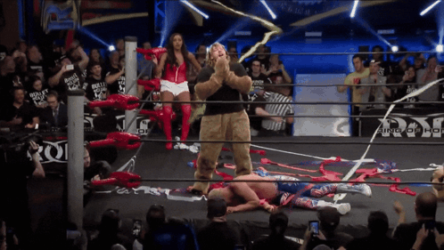 Man in Teddy Bear Costume With Ring of Honor Sign
