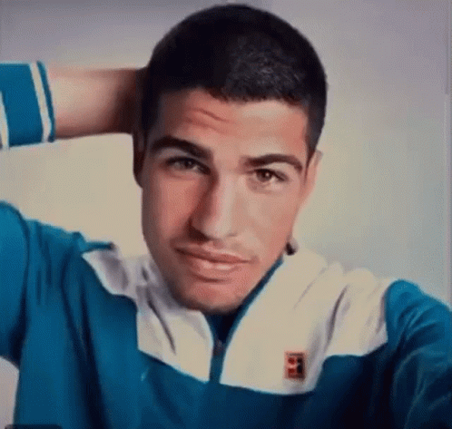 Man In Tennis Uniform Making Funny Face To Crowd GIF