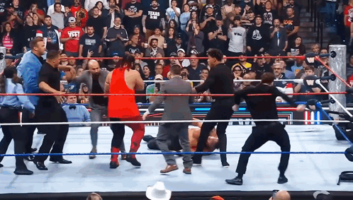 Man in Texas A&M Shirt Standing in Wrestling Ring