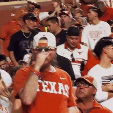 Man in Texas Shirt in Crowd