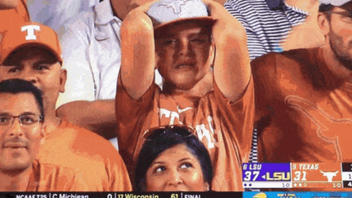 Man in Texas Shirt Watching LSU Game