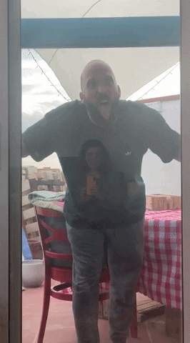 Man In The Mirror Hurting Himself GIF