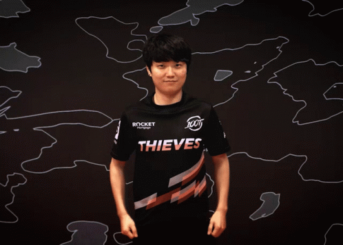 Man in Thieves Shirt Flexing Muscles