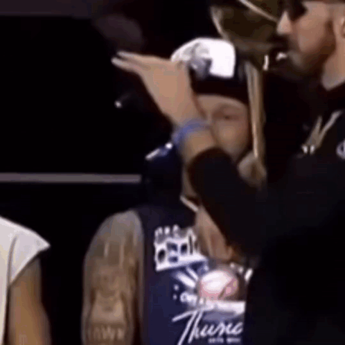 Man in Thunder Shirt and Another Man