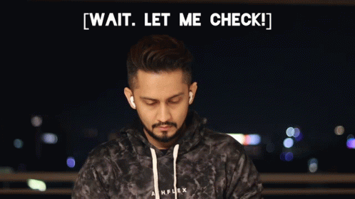 Man in Tie-Dye Hoodie Wait Let Me Check