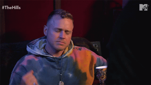 Man in Tie Dye Hoodie Watching Hills
