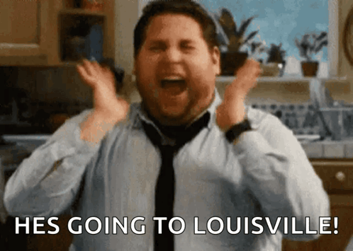 Man in Tie Going to Louisville in Kitchen