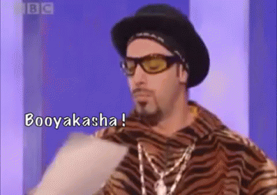 Man in Tiger Print Shirt Holding Paper Says Booyakasha