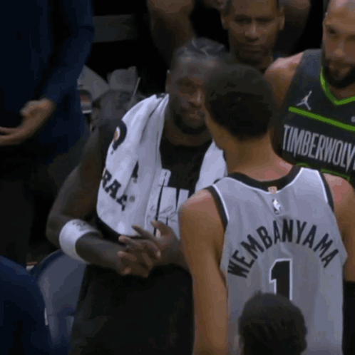 Man in Timberwolves Jersey Shaking Hands