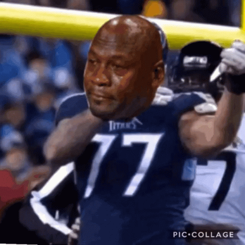 Man in Titans Jersey Holding Football